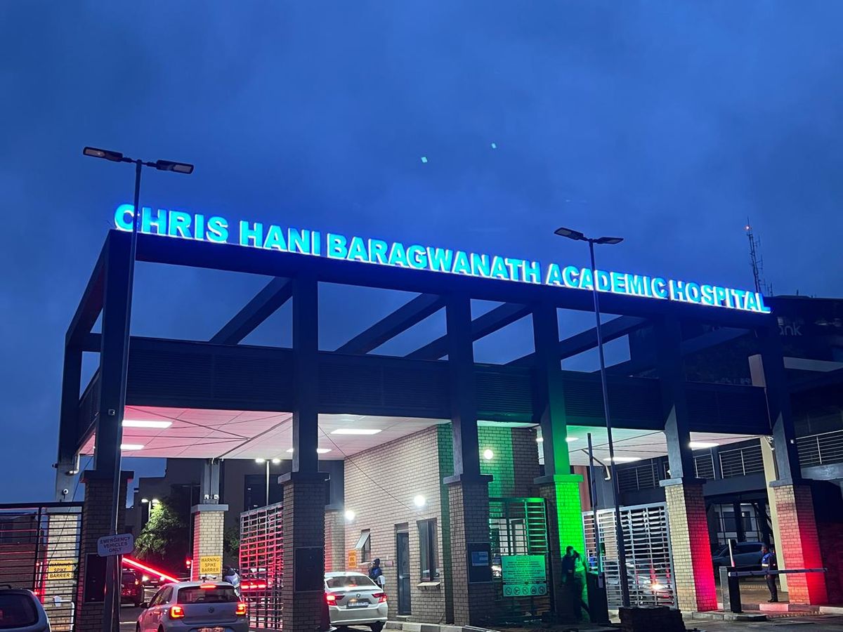 Chris Hani Baragwanath Academic Hospital illuminated entrance lettering at night