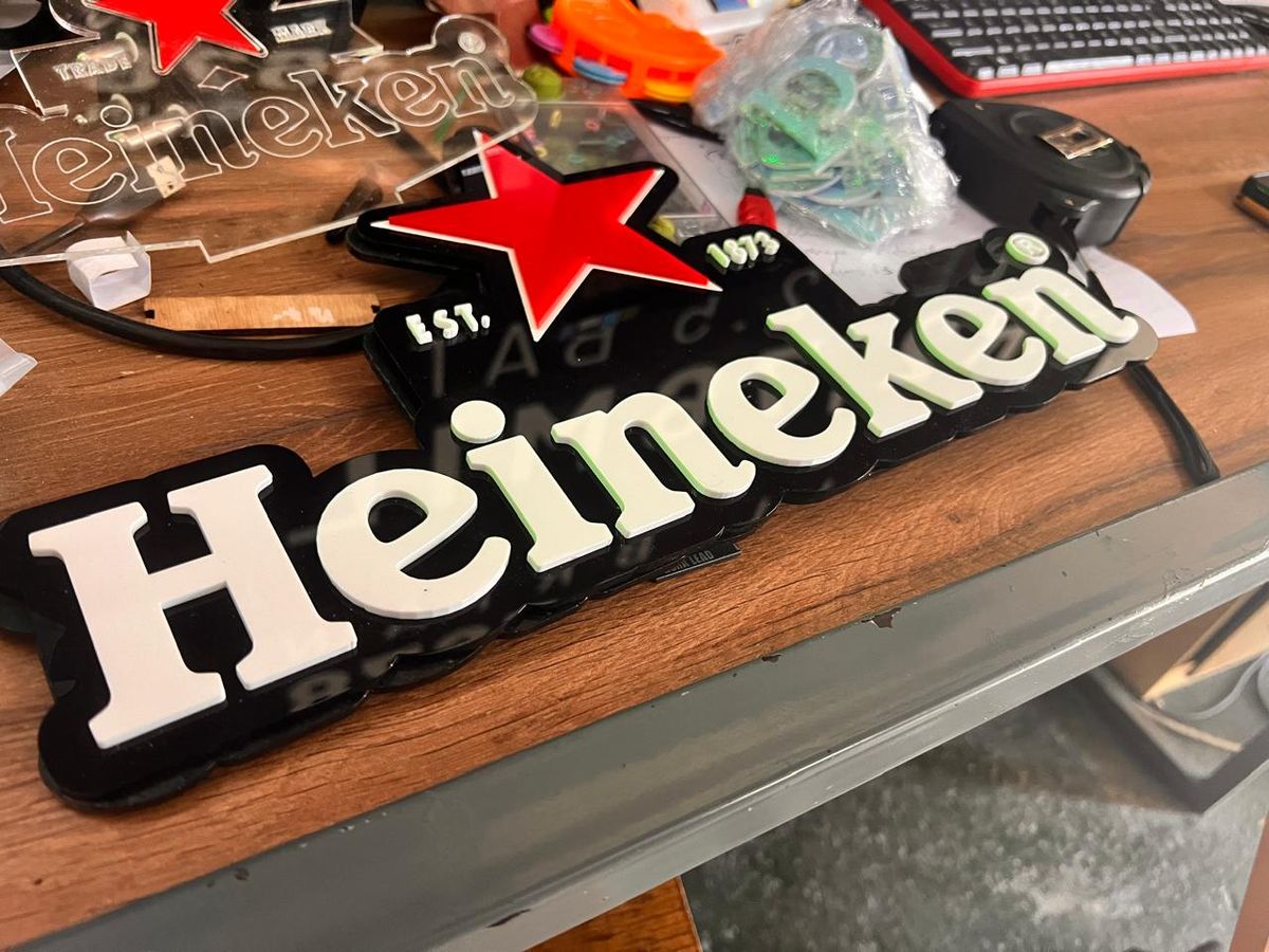 Heineken 3D fabricated black and white lettering with a red star