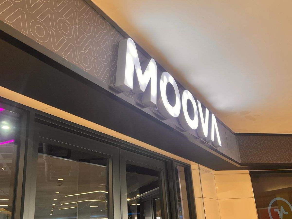 MOOVA illuminated white 3D letters on a black fascia