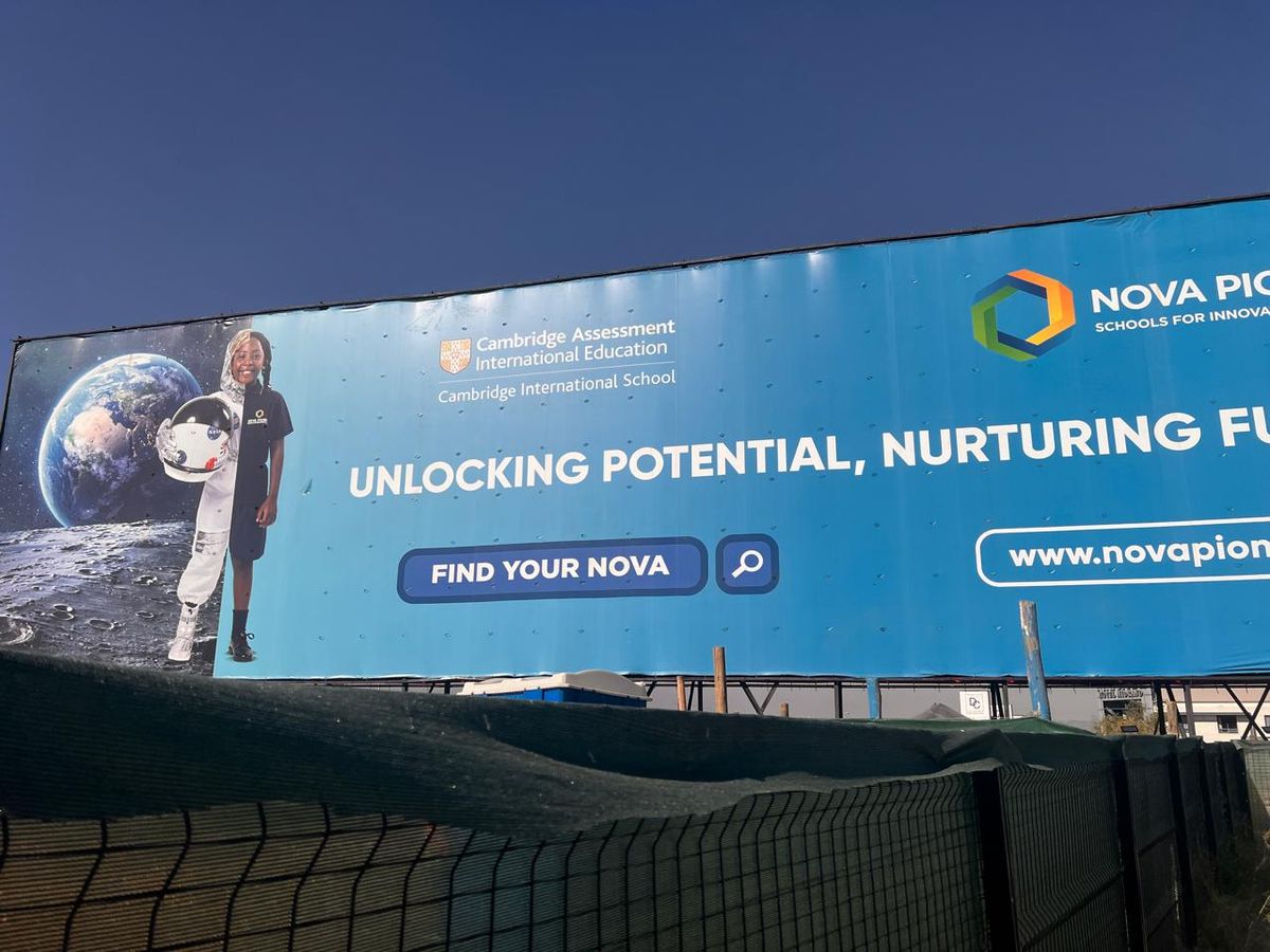 Nova Pioneer billboard mounted on a roadside frame