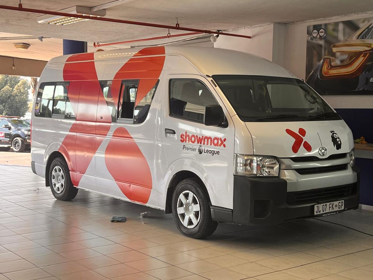 White van with red Showmax vehicle wrap graphics